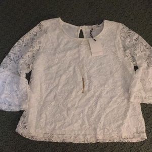White lace bell-sleeved blouse